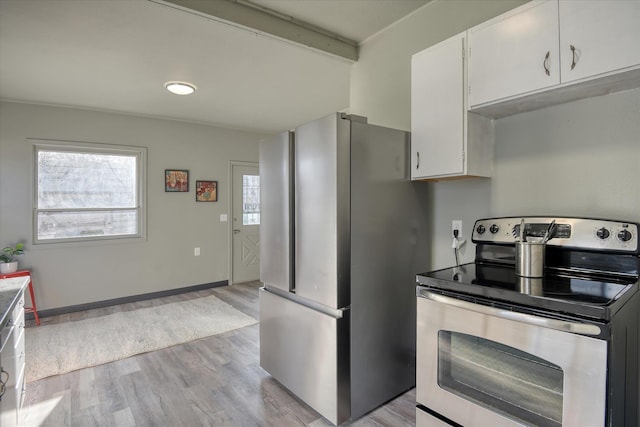 1121 W Knox Ave, Spokane, WA 99205 - kitchen featuring stainless steel appliances, light wood-style flooring, and white cabinets