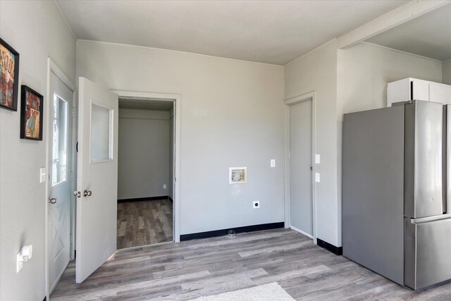 1121 W Knox Ave, Spokane, WA 99205 - kitchen with freestanding refrigerator, white cabinetry, and light wood-type flooring