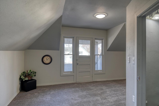 1121 W Knox Ave, Spokane, WA 99205 - carpeted foyer featuring a textured ceiling, vaulted ceiling, and baseboards