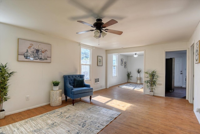 324 E Everett Ave, Spokane, WA 99207 - living area featuring ceiling fan, wood finished floors, and baseboards