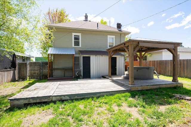 1207 E Wabash Ave, Spokane, WA 99207 - back of house featuring a hot tub, a gazebo, a fenced backyard, and a deck