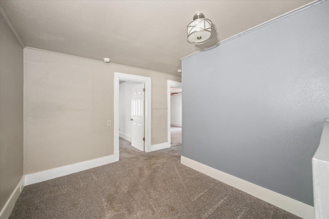 1207 E Wabash Ave, Spokane, WA 99207 - carpeted spare room with baseboards, ornamental molding, and a smoke detector