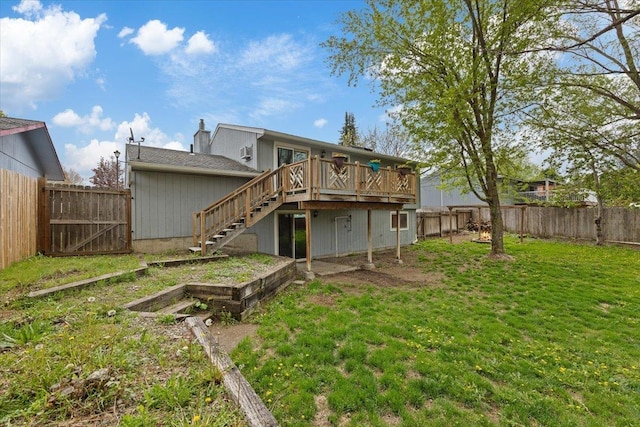 15121 N Meadowview Dr, Mead, WA 99021 - back of property featuring a wooden deck, stairs, a vegetable garden, and a gate
