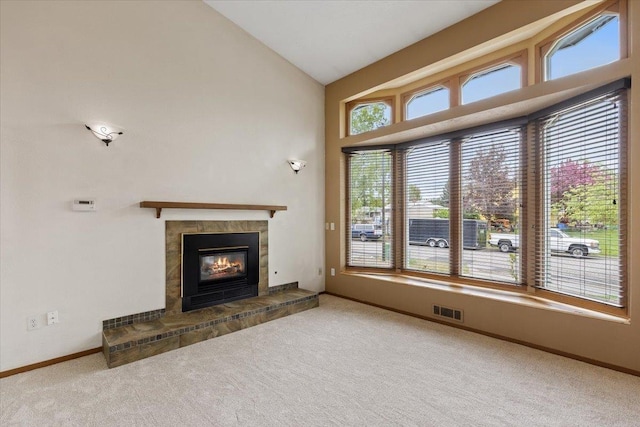 15121 N Meadowview Dr, Mead, WA 99021 - unfurnished living room with carpet, a fireplace, baseboards, and high vaulted ceiling