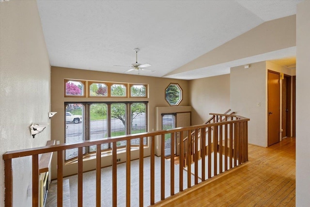 15121 N Meadowview Dr, Mead, WA 99021 - hallway with an upstairs landing, lofted ceiling, and hardwood / wood-style floors