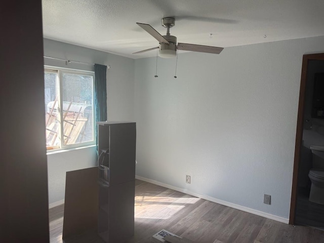 1468 Veit Rd, Newport, WA 99156 - spare room with wood finished floors, baseboards, and a ceiling fan