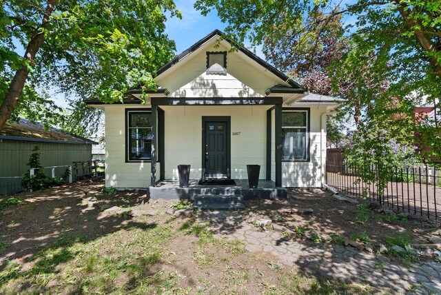 view of front of house with fence