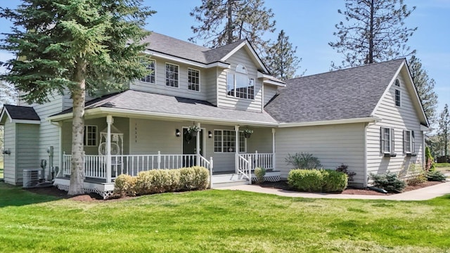view of front of property with covered porch, a shingled roof, central AC, and a front yard