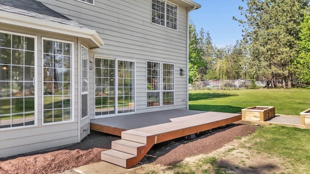 wooden deck with a lawn