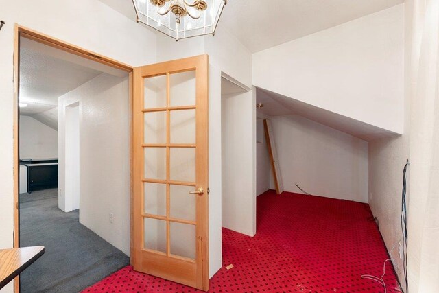 1725 N Park Rd, Spokane Valley, WA 99212 - additional living space featuring carpet floors, a chandelier, and lofted ceiling