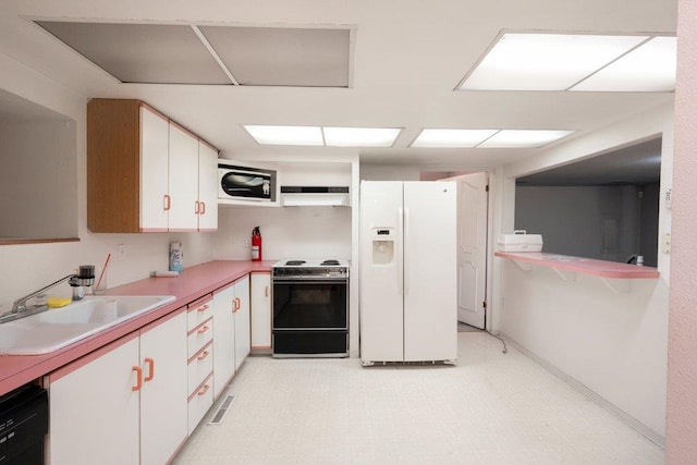 1725 N Park Rd, Spokane Valley, WA 99212 - kitchen with white refrigerator with ice dispenser, electric range, a sink, white cabinets, and under cabinet range hood