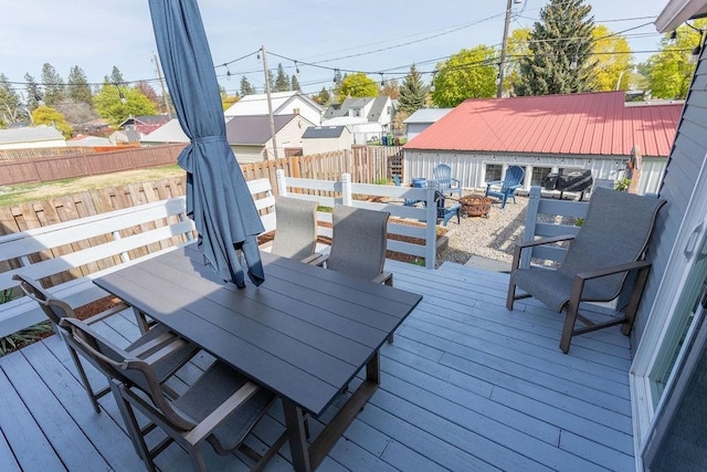 2804 W Crown Ave, Spokane, WA 99205 - wooden terrace with a fire pit, outdoor dining area, and a fenced backyard