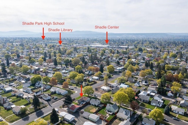 2804 W Crown Ave, Spokane, WA 99205 - aerial view of property and surrounding area featuring a mountainous background and nearby suburban area