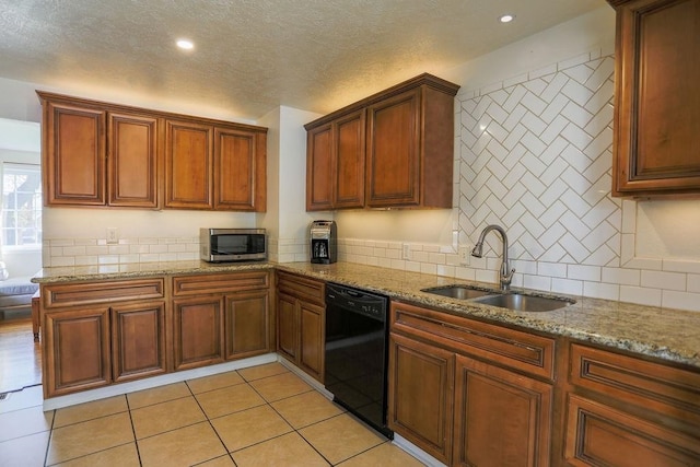 2804 W Crown Ave, Spokane, WA 99205 - kitchen with dishwasher, stainless steel microwave, a sink, backsplash, and light stone counters