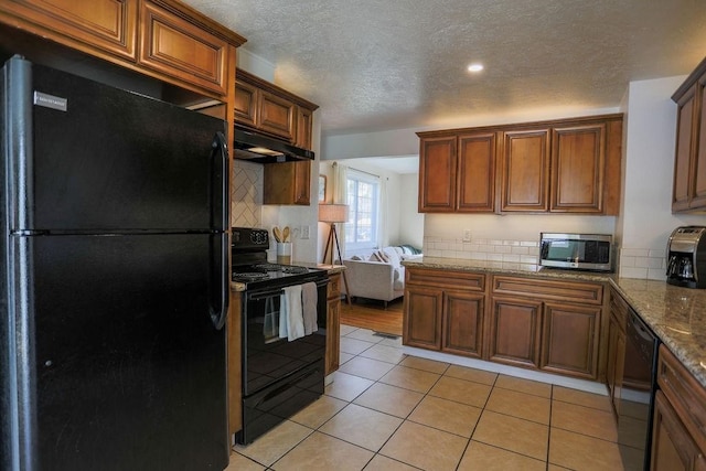 2804 W Crown Ave, Spokane, WA 99205 - kitchen featuring black appliances, under cabinet range hood, tasteful backsplash, a textured ceiling, and light tile patterned floors