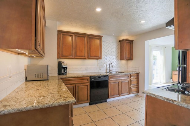 2804 W Crown Ave, Spokane, WA 99205 - kitchen with black appliances, a sink, a textured ceiling, tasteful backsplash, and brown cabinets