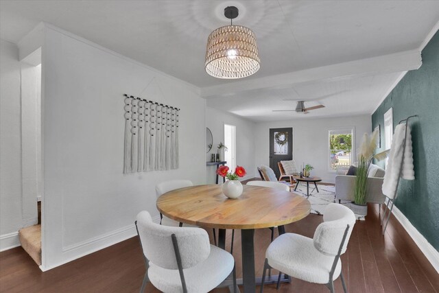 2709 E Sharp Ave, Spokane, WA 99202 - dining room featuring wood finished floors, a chandelier, baseboards, ceiling fan, and arched walkways