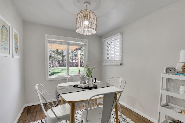 2709 E Sharp Ave, Spokane, WA 99202 - dining room with baseboards and wood finished floors