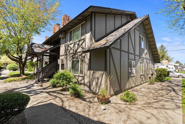 304 E Weile Ave Unit 4, Spokane, WA 99208 - view of home's exterior with stairs and a chimney