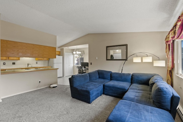 304 E Weile Ave Unit 4, Spokane, WA 99208 - living area featuring vaulted ceiling, carpet floors, a chandelier, baseboard heating, and a textured ceiling