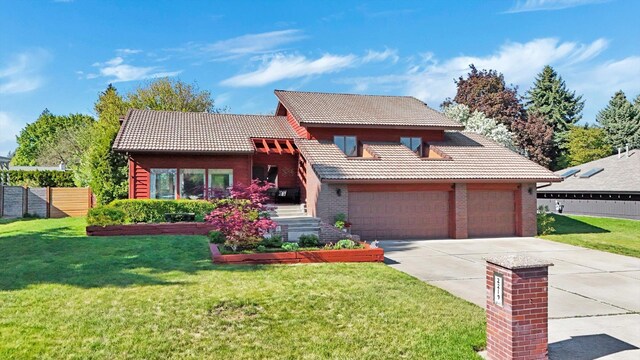 view of front of house with a tile roof, concrete driveway, an attached garage, and brick siding