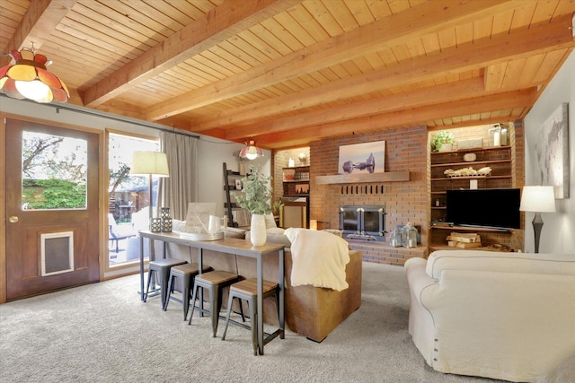 carpeted living room featuring wooden ceiling, beamed ceiling, a fireplace, and built in shelves