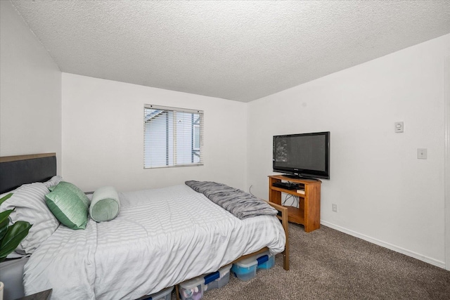 306 E Weile Ave Unit 3, Spokane, WA 99208 - carpeted bedroom featuring baseboard heating, a textured ceiling, a closet, ceiling fan, and baseboards