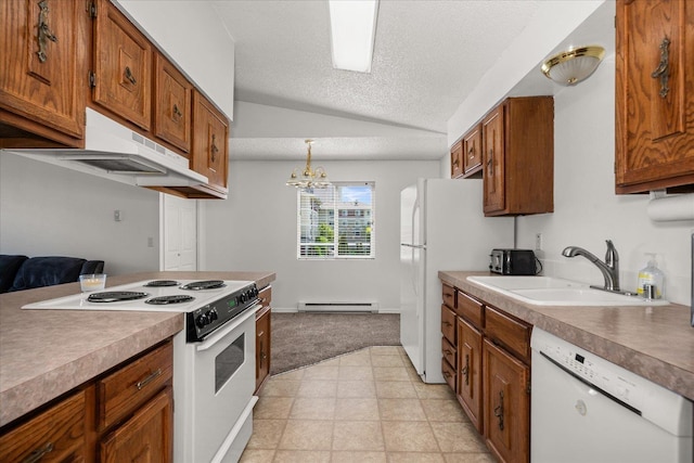 306 E Weile Ave Unit 3, Spokane, WA 99208 - kitchen with white appliances, brown cabinets, a peninsula, a sink, and light countertops