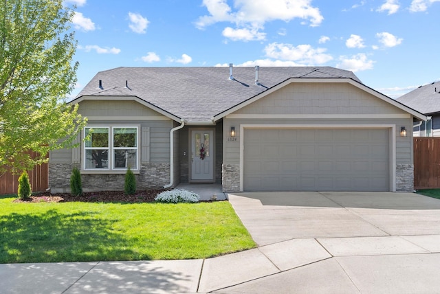 ranch-style house with stone siding, a shingled roof, an attached garage, and concrete driveway