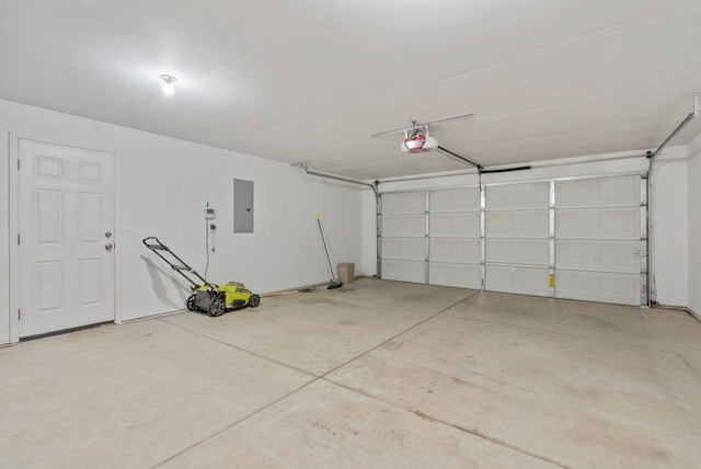 garage with electric panel and a garage door opener