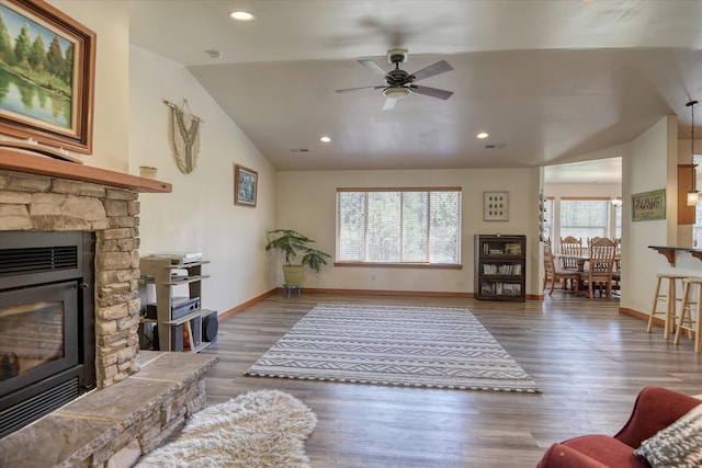 living room with vaulted ceiling, ceiling fan, baseboards, wood finished floors, and recessed lighting