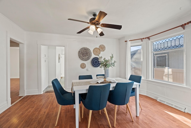 1018 E Broad Ave, Spokane, WA 99207 - dining room with wood finished floors, a ceiling fan, and baseboards