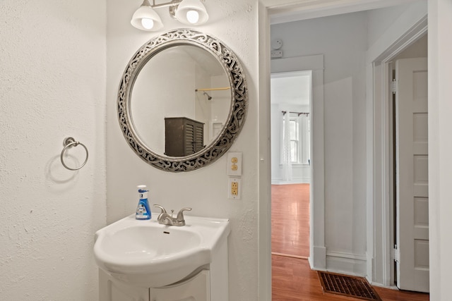 1018 E Broad Ave, Spokane, WA 99207 - bathroom featuring a sink and wood finished floors