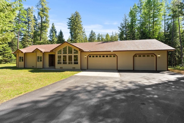 2238 Green Rd, Newport, WA 99156 - view of front of property with an attached garage, a front yard, and asphalt driveway