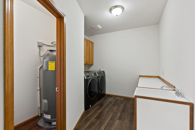 2238 Green Rd, Newport, WA 99156 - laundry area with cabinet space, independent washer and dryer, electric water heater, and dark wood-style flooring