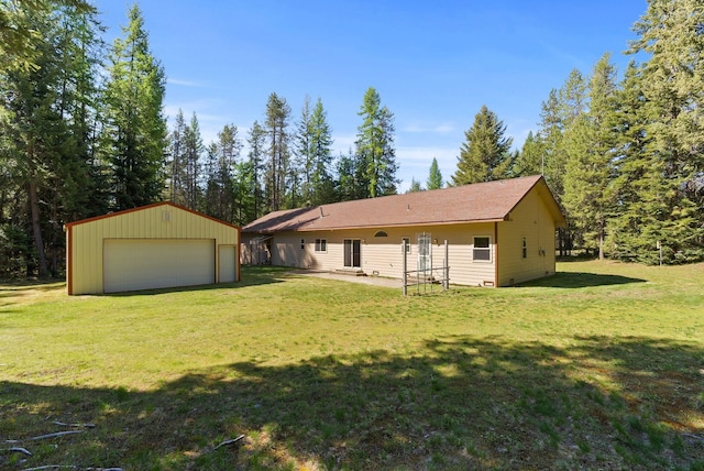 2238 Green Rd, Newport, WA 99156 - view of front facade featuring a detached garage, an outbuilding, and a front lawn