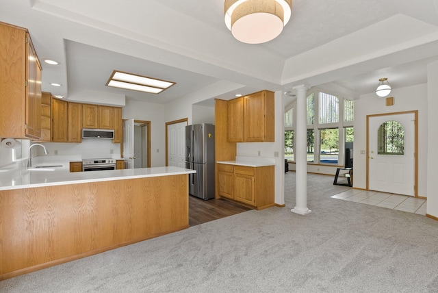 2238 Green Rd, Newport, WA 99156 - kitchen featuring stainless steel appliances, ornate columns, carpet flooring, a sink, and light countertops