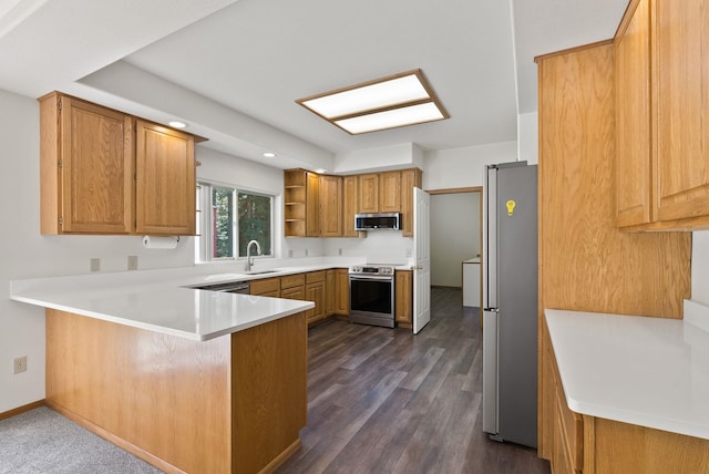 2238 Green Rd, Newport, WA 99156 - kitchen featuring stainless steel appliances, a peninsula, open shelves, a sink, and dark wood finished floors