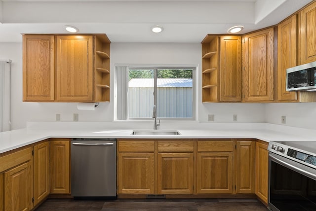 2238 Green Rd, Newport, WA 99156 - kitchen featuring appliances with stainless steel finishes, open shelves, a sink, brown cabinetry, and light countertops