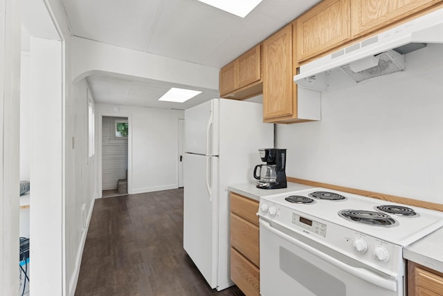kitchen with white appliances, under cabinet range hood, light countertops, dark wood-style flooring, and baseboards