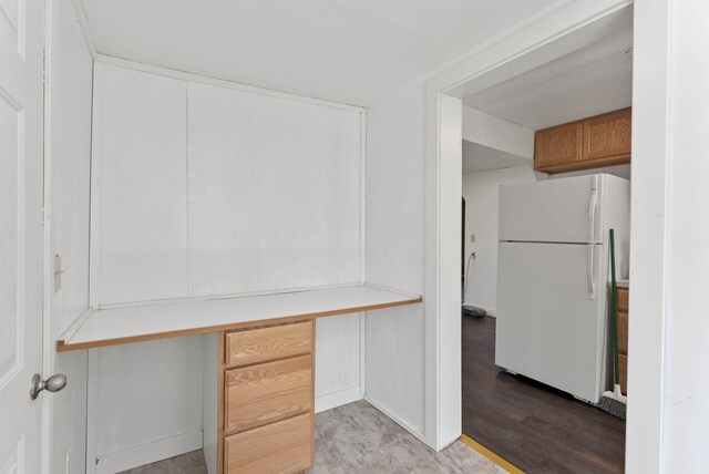 unfurnished office featuring built in study area