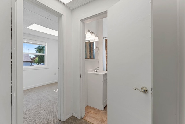 bathroom featuring vanity and baseboards
