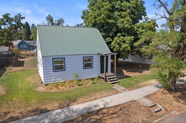 a-frame style home featuring metal roof