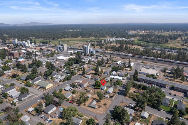 aerial overview of property's location featuring a forest