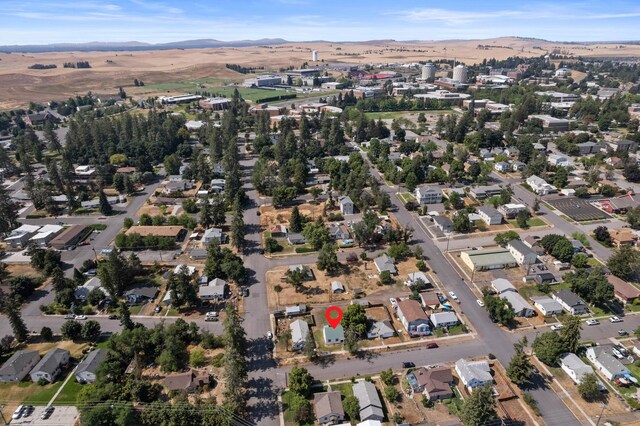 view of property location with mountains and nearby suburban area