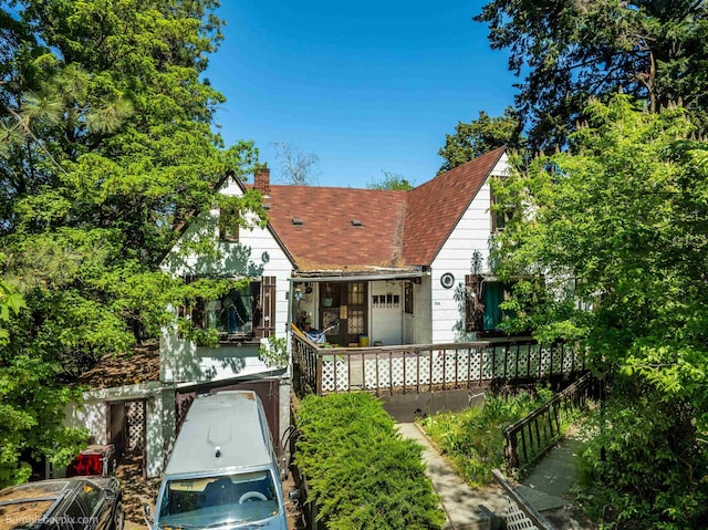 1114 W 7th Ave, Spokane, WA 99204 - view of front facade featuring a chimney, a shingled roof, and a porch