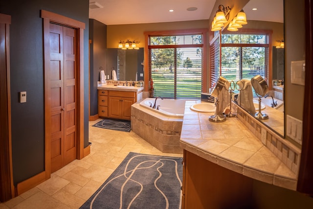 21621 N Lang Ln, Chattaroy, WA 99003 - full bathroom featuring a bath, vanity, a chandelier, baseboards, and recessed lighting