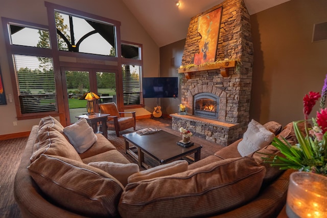 21621 N Lang Ln, Chattaroy, WA 99003 - living room featuring high vaulted ceiling, baseboards, a fireplace, and wood finished floors
