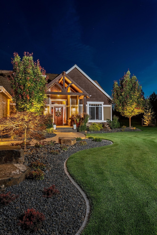 21621 N Lang Ln, Chattaroy, WA 99003 - back of house at twilight featuring a yard