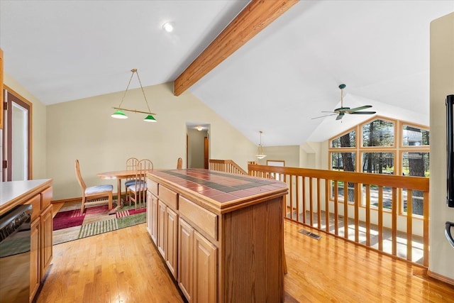 14512 N Dartford Dr, Spokane, WA 99208 - kitchen with tile counters, dishwasher, light wood-type flooring, and a ceiling fan